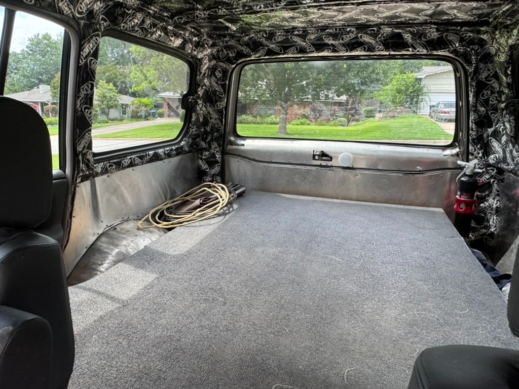 Side view of cargo deck, sound deadener wrapping up the D-pillar, sleeper bed platform extending the full width