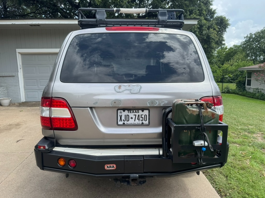 Rear ARB bumper with jerry can mount and full-size spare strategy