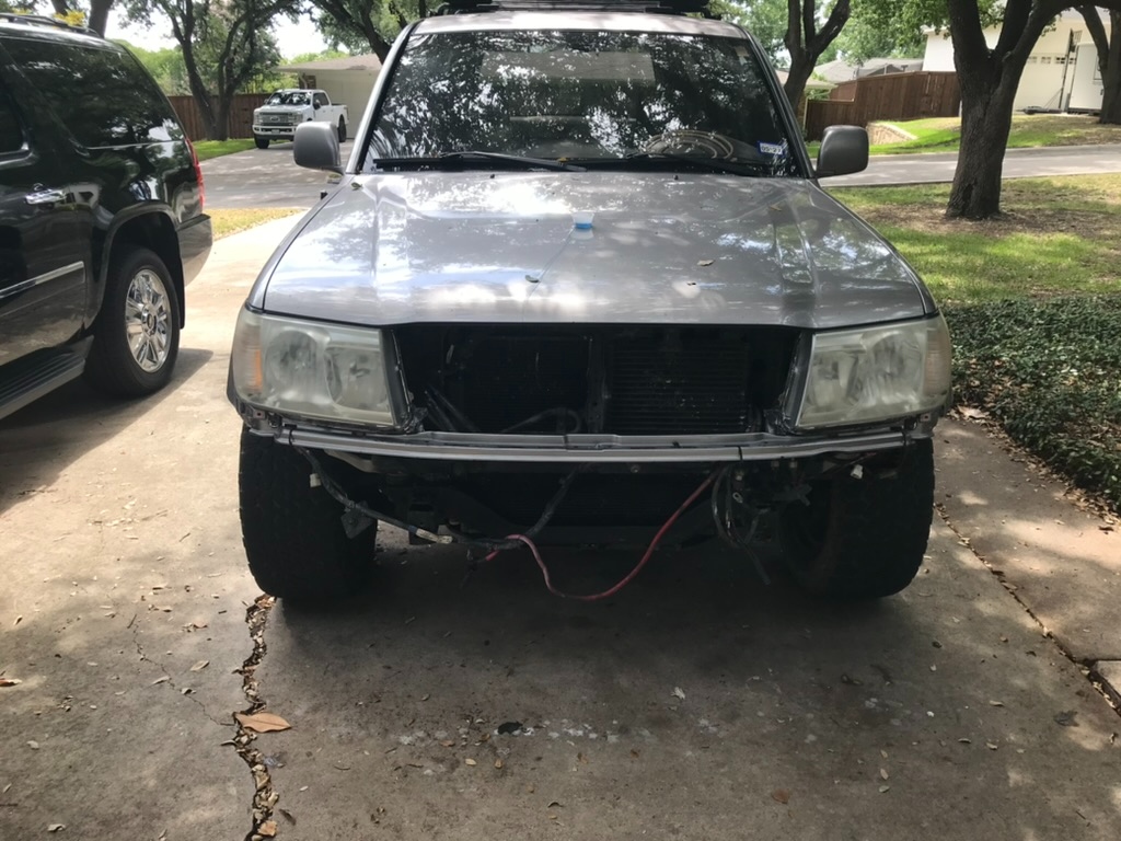 Front clip removed, headlights out for service