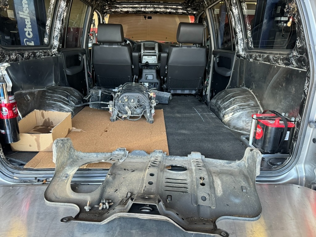 Skid plate removed and heater core area visible