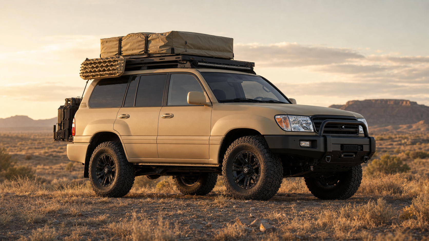 2006 Land Cruiser Sahara Edition vision build — matte sahara sand respray with tan canvas roof tent, West Texas desert