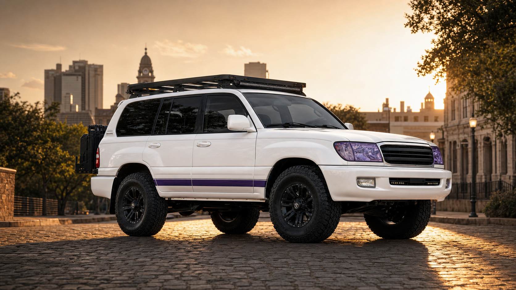 2006 Land Cruiser TCU Edition vision build — pearl white with Horned Frog purple stripe, Fort Worth cobblestone setting